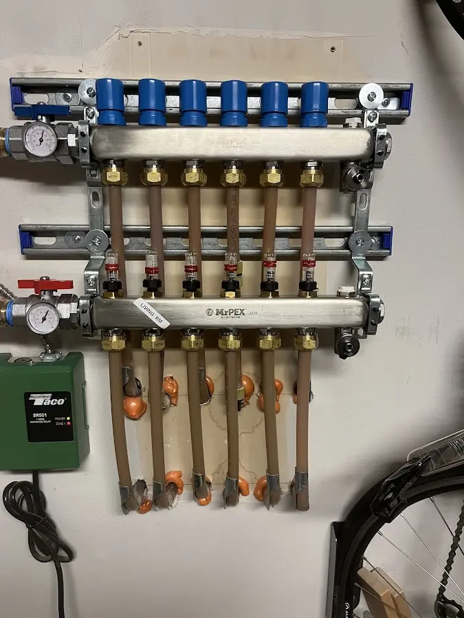 Plumber performing Water Heater Repair at a residential property in Fort Lee